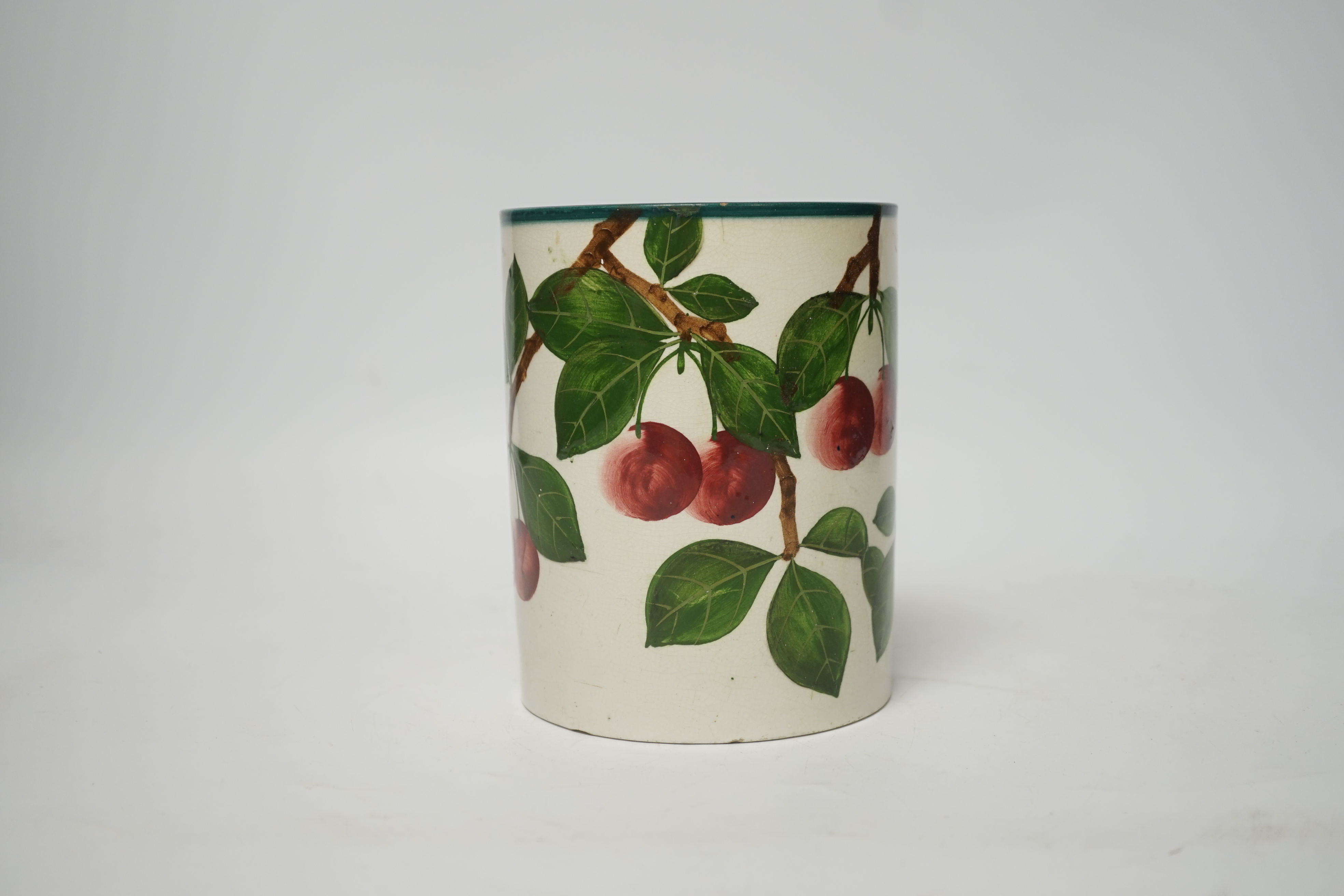 A Wemyss mug with cherry decoration (restored a.f.), 14cm high